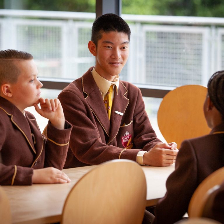 boys sat at a table