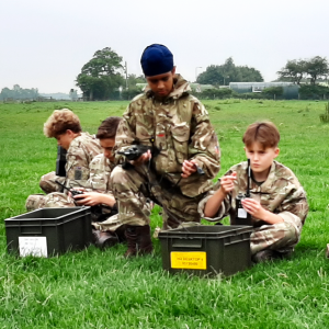 children sat on the floor during army style training