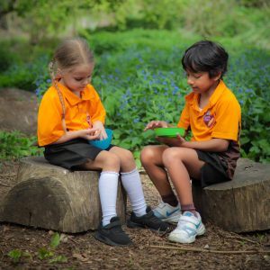 Two students learning outdoors