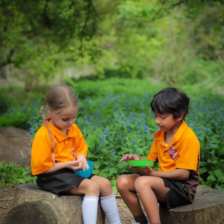 children sat on a log