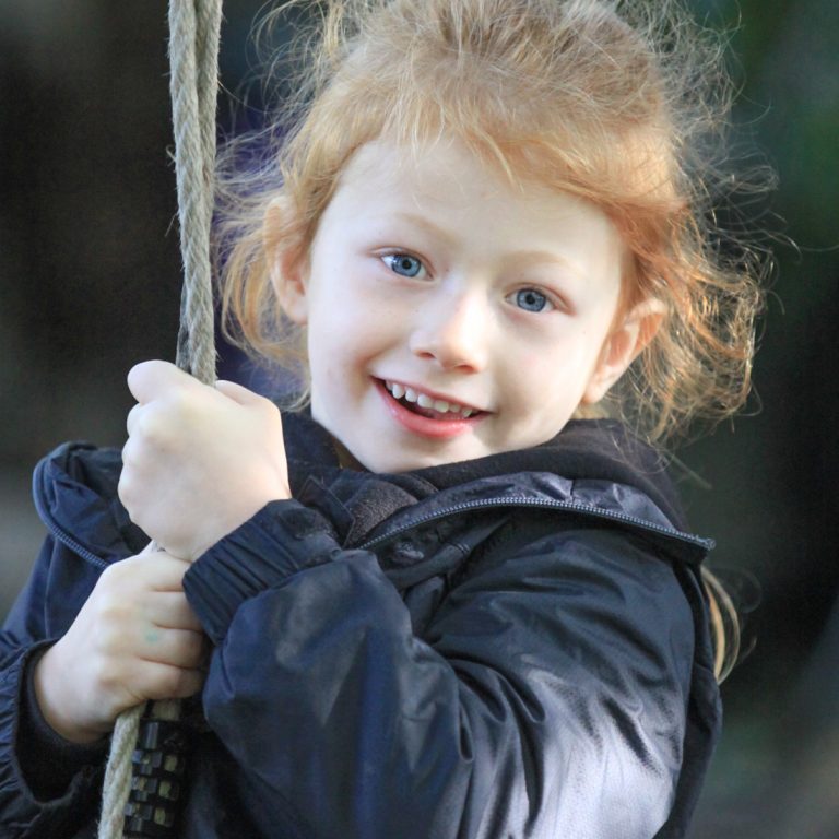 girl holding a rope