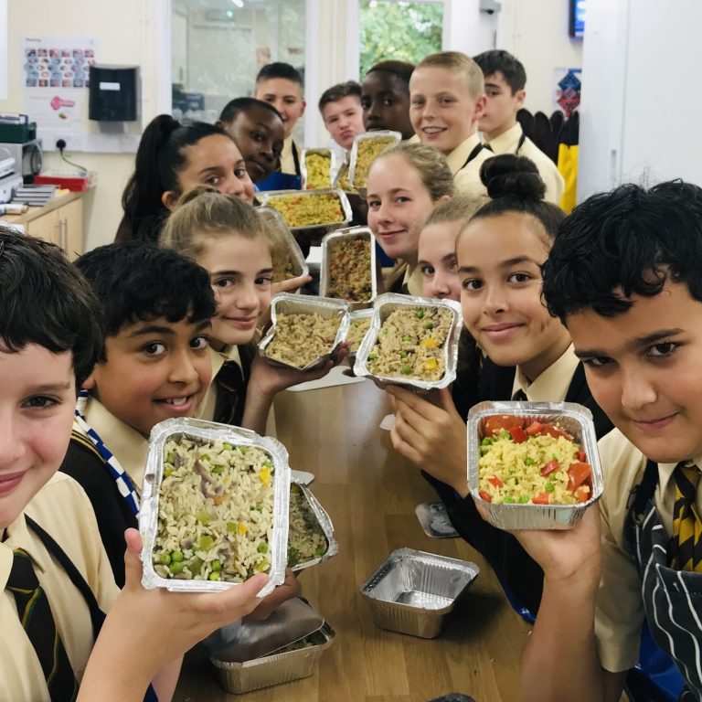 children holding up food